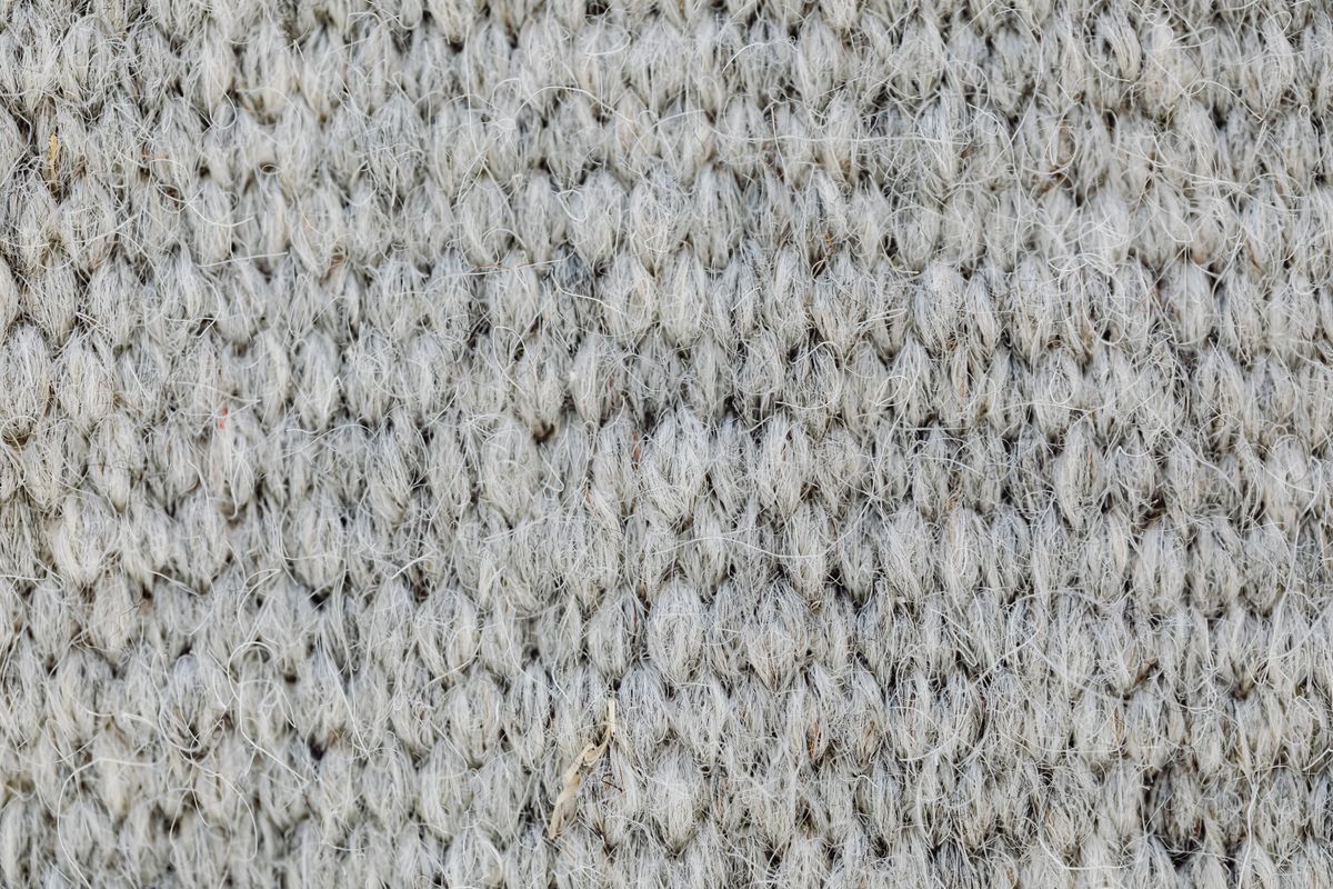 Macro of a gray wool knit showing crimped fibers
